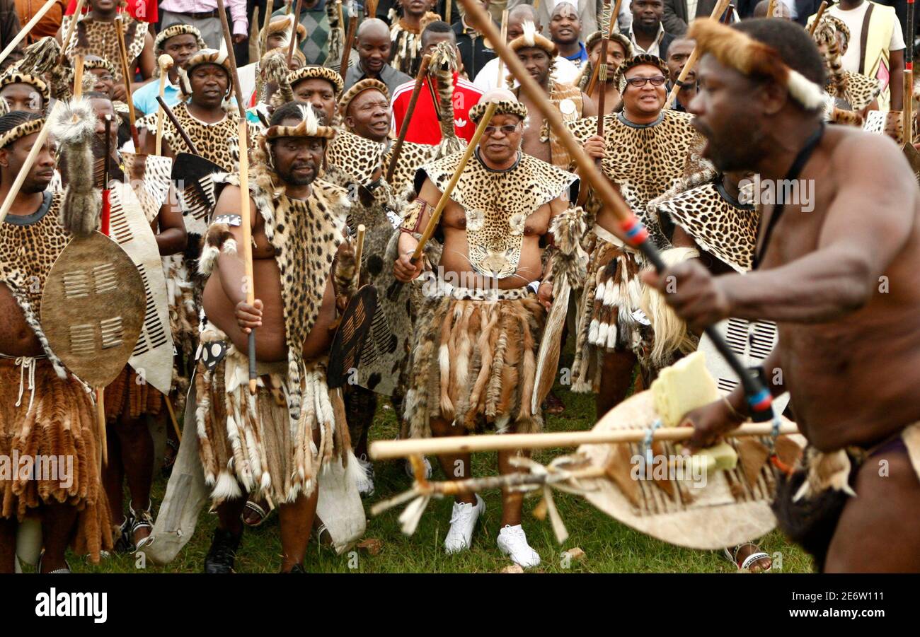 South African President Jacob Zuma (C) takes part in a dance during his  traditional wedding to Tobeka Madiba, his fifth wife, at the village of  Nkandla in northern KwaZulu-Natal January 4, 2010.
