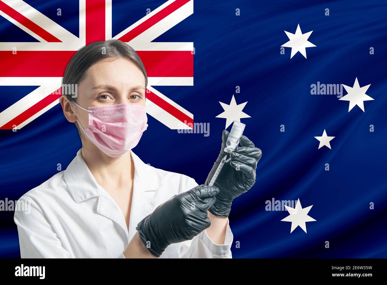 La jeune fille prépare la vaccination contre le fond du drapeau de l'Australie. Concept de vaccination Australie. Banque D'Images