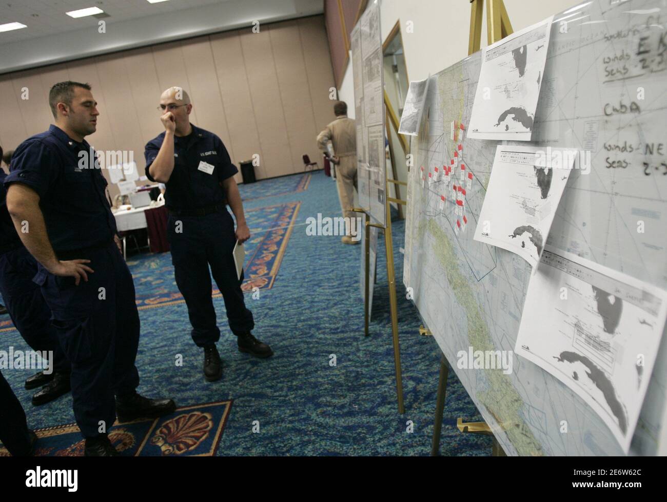 Us Coast Guard Officers Stand In Front Of Maps During A Table Top Exercise About Massive Migration In Fort Lauderdale Florida December 13 06 More Than A Dozen Of Agencies Attended Practice Emergency