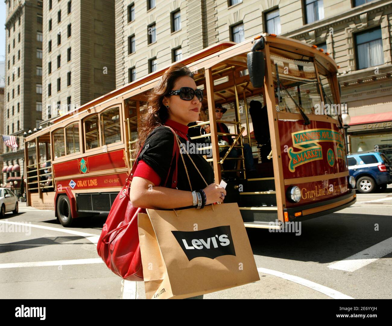 Vanessa Heshiki carries a shopping bag after a purchase at the Levi's  retail store in San Francisco, California April 13, 2010 when it announced  its first quarter earnings. Levi's has been opening