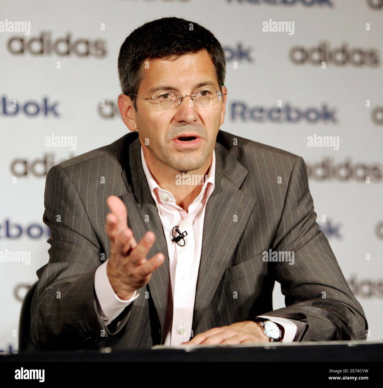 Adidas chief executive Hainer speaks during a news conference with Reebok  chief executive Fireman in Canton, Massachusetts. Herbert Hainer, chairman  and chief executive of Adidas-Salomon, speaks during a news conference with  Paul