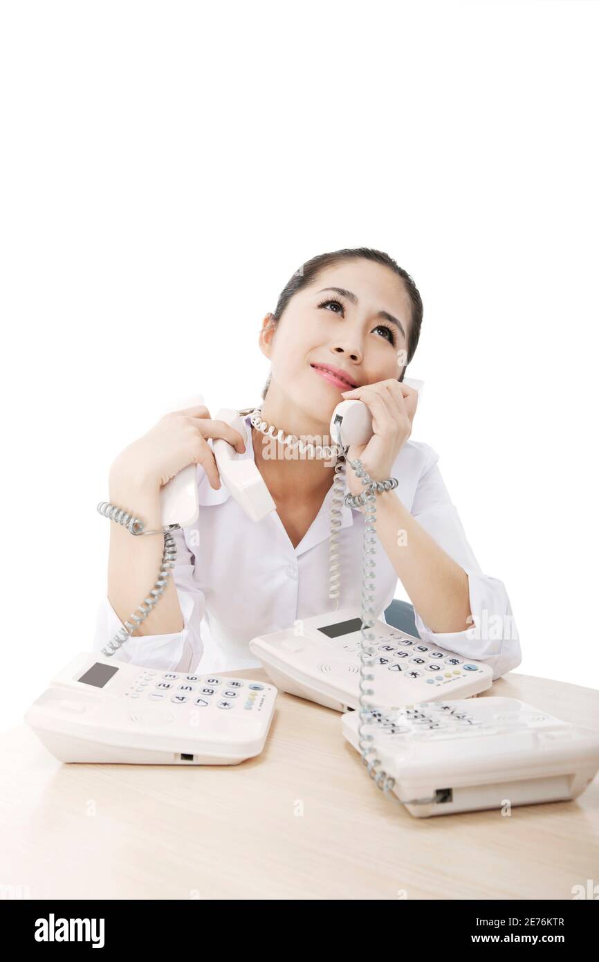 Femme d'affaires et trois téléphones photo de haute qualité Banque D'Images