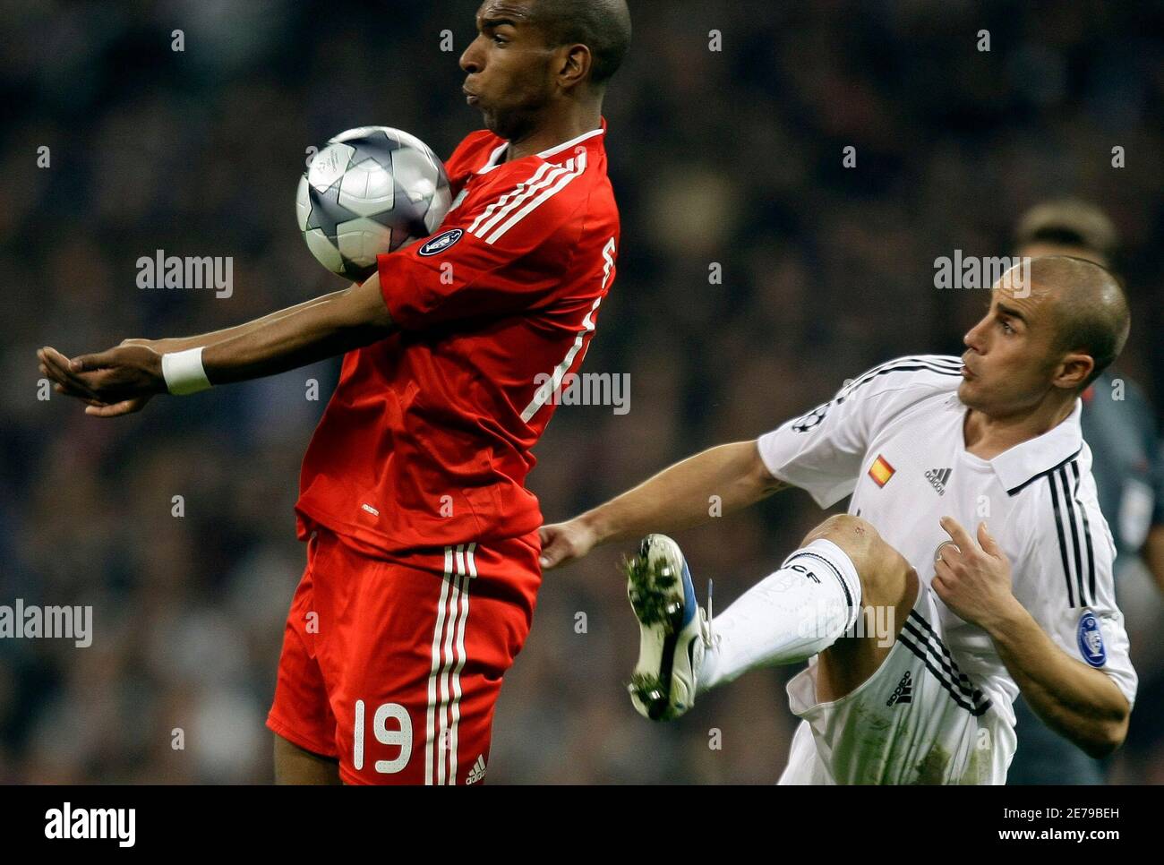 Liverpool S Ryan Babel L Controls The Ball In Front Of Real Madrid S Fabio Cannavaro During Their Champions League Soccer Match At Santiago Bernabeu Stadium In Madrid February 25 09 Reuters Sergio Perez Spain