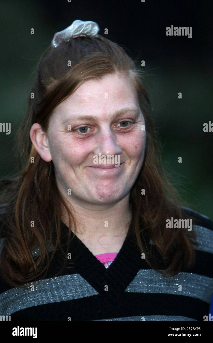 Karen Matthew, the mother of Dewsbury girl Shannon Matthews, who was  missing and later found, smiles in front of the cameras, outside her house  in Dewsbury, northern England March 15, 2008. Detective
