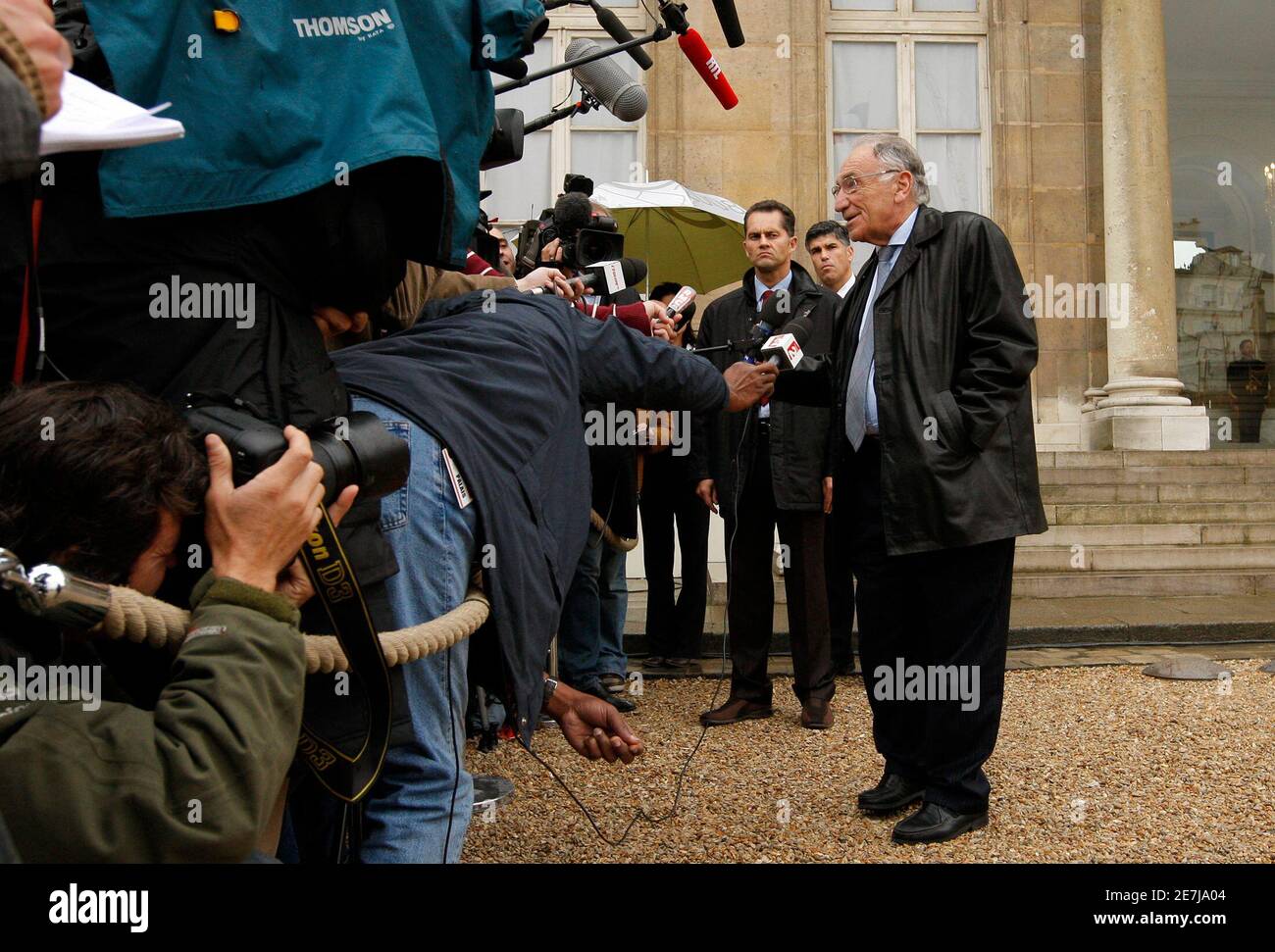 Jean-Pierre Escalettes (R), President of the French football federation (FFF),  speaks to the media in the courtyard at the Elysee Palace after a meeting  with France's President Nicolas Sarkozy in Paris October