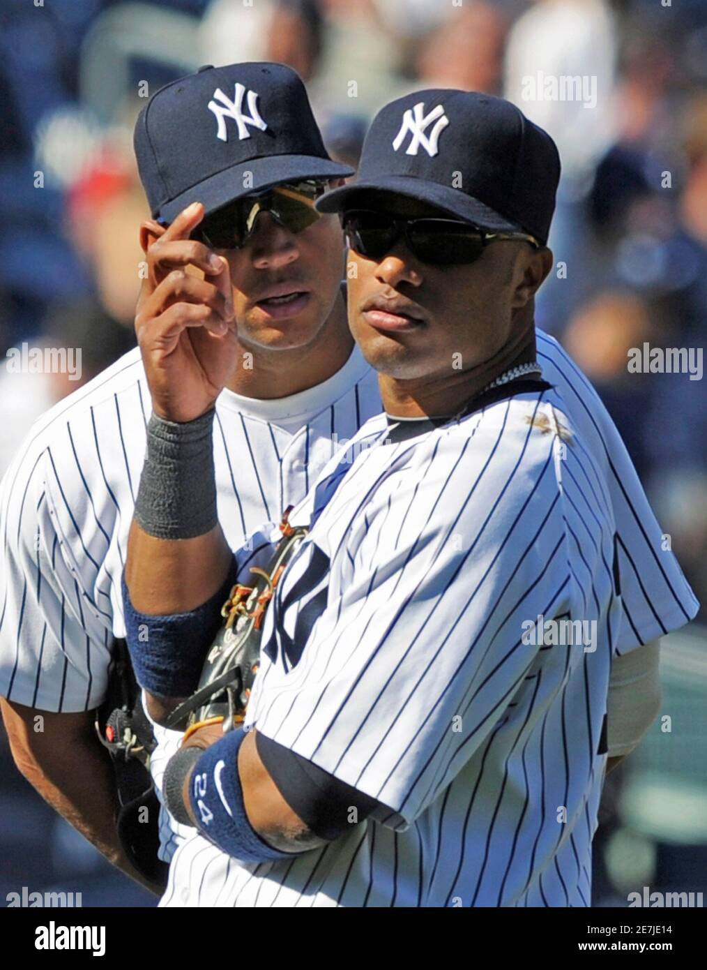 New York Yankees third baseman Alez Rodriguez talks with second baseman  Robinson Cano during a pitching change against the Baltimore Orioles in the  eighth inning of their MLB American League baseball game