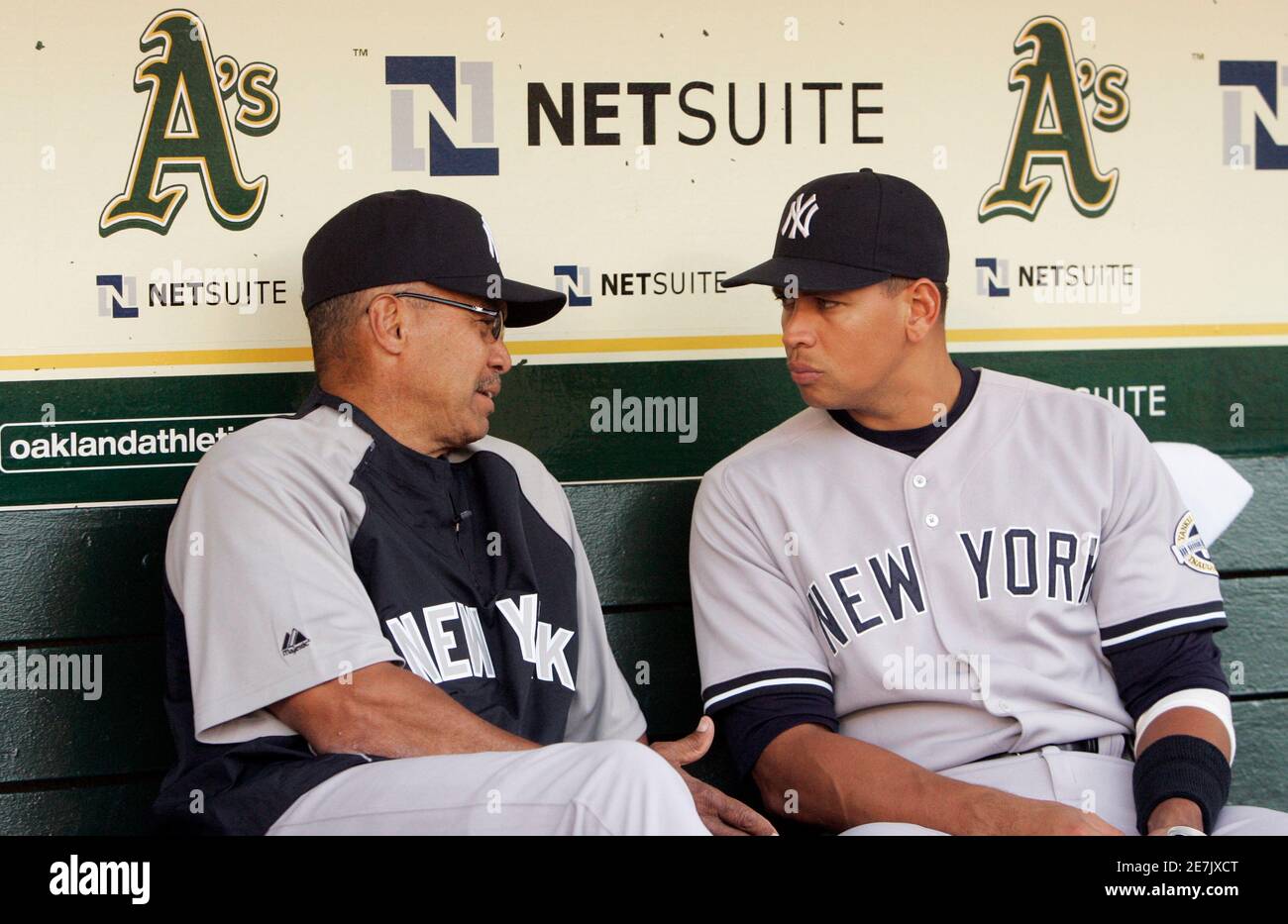 Former New York Yankees and Oakland Athletics hall of fame baseball player  Reggie Jackson (L) talks with current Yankees player Alex Rodriguez prior  to the Yankees' MLB American League baseball game against