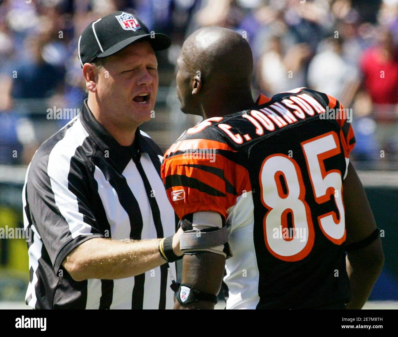 Cincinnati Bengals wide receiver Chad Johnson is kept back by head linesman  Jerry Bergman at the start of the Bengals' NFL football game against the  Baltimore Ravens in Baltimore, Maryland September 7,
