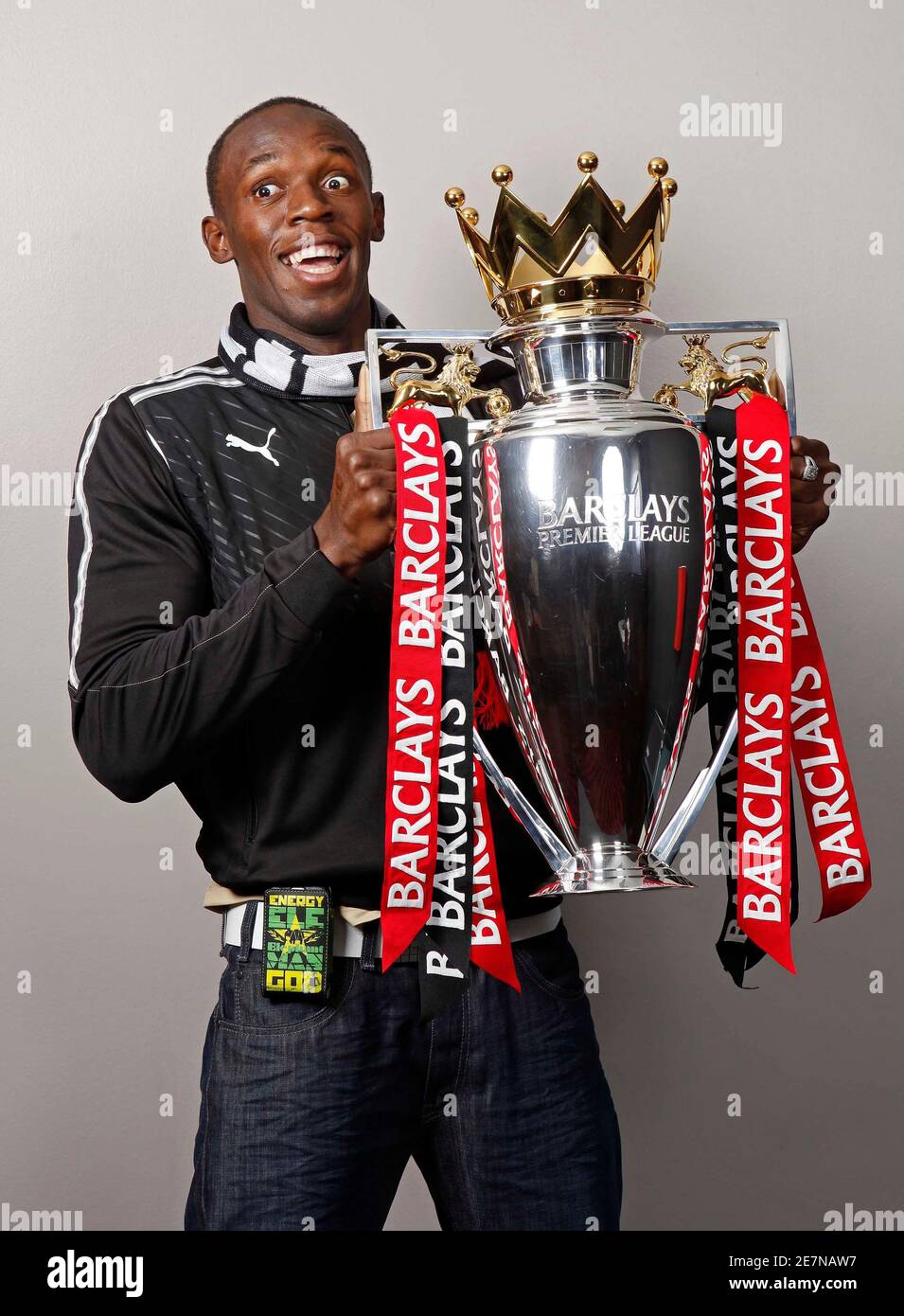 Jamaican sprinter Usain Bolt, who is a Manchester United fan, poses with  the English Premier League trophy in Manchester May 15, 2009. Triple  Olympic champion Bolt takes to the streets of Manchester