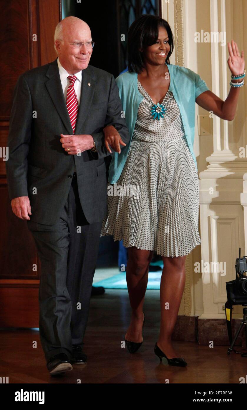 U.S. first lady Michelle Obama enters the East Room of the White House with  U.S. Senator Patrick Leahy (D-VT) during a reception for the new Supreme  Court Associate Justice Sonia Sotomayor in