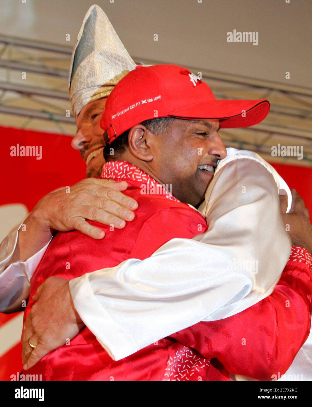 Britain S Virgin Founder Richard Branson R And Malaysian Airasia X Major Owner Tony Fernandes Embrace After A Signing Ceremony In Putrajaya Outside Kuala Lumpur In This August 10 2007 File Photo Fernandes