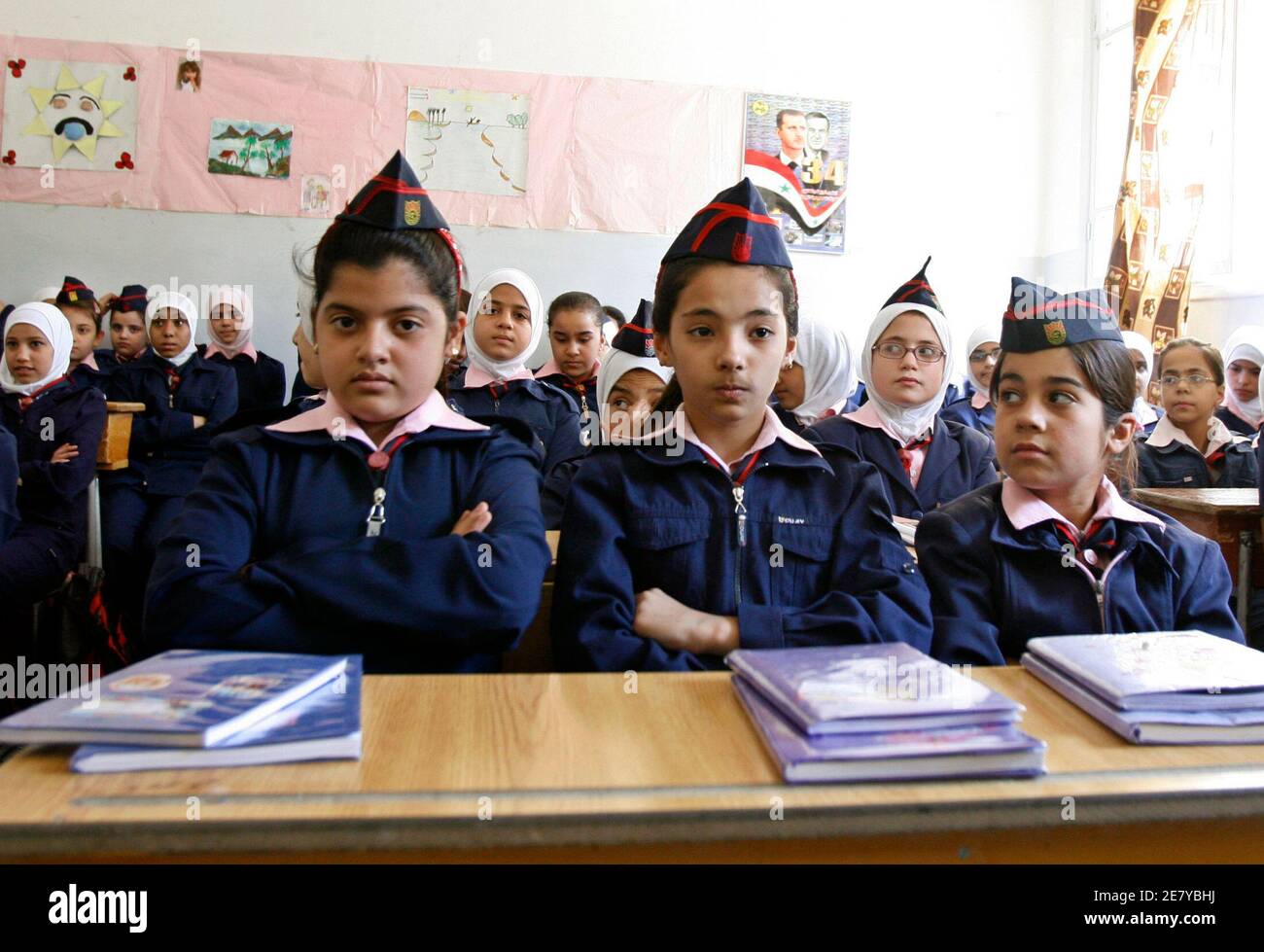 Iraqi refugee students wait in their classroom with Syrian students before  UNHCR Arab world good will ambassador and renowned Arab comedian Adel Imam  arrived at their school in the Damascus suburb of