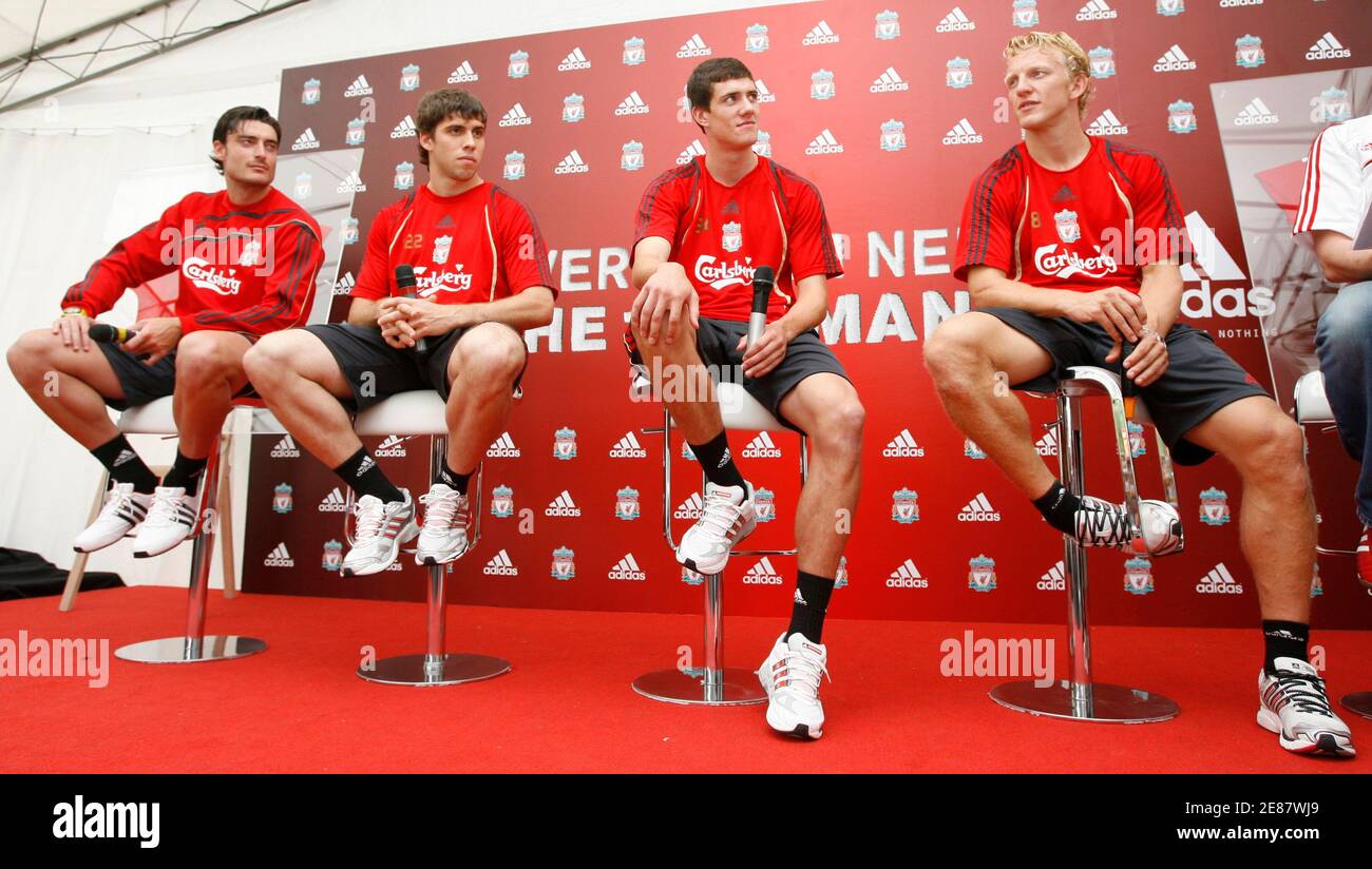 Liverpool's (L-R) Albert Riera, Emiliano Insua, Martin Kelly and Dirk Kuyt  attend a promotional event at a mall in Singapore July 24, 2009. Liverpool  will play the Singapore national team on Sunday