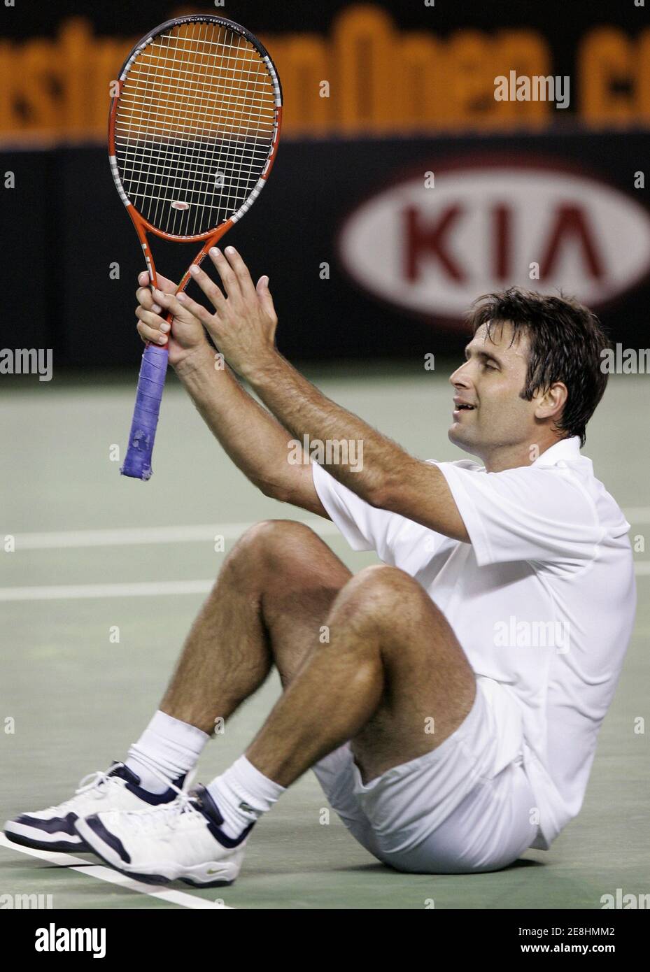 Fabrice Santoro of France reacts to beating David Ferrer of Spain at the Australian Open tennis tournament in Melbourne January 22, 2006. REUTERS/Claro Cortes IV Banque D'Images