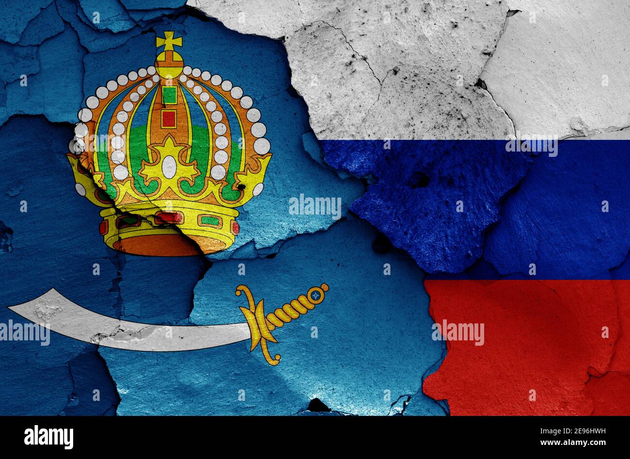 Drapeaux de l'oblast d'Astrakhan et de la Russie peints sur un mur fissuré Banque D'Images