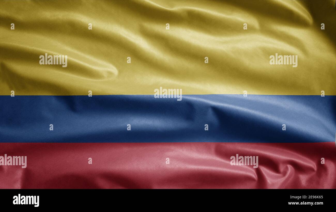Drapeau colombien agitant dans le vent. Gros plan de la bannière Colombie, soie douce et lisse. Tissu texture ensign arrière-plan. Utilisez-le pour natio Banque D'Images