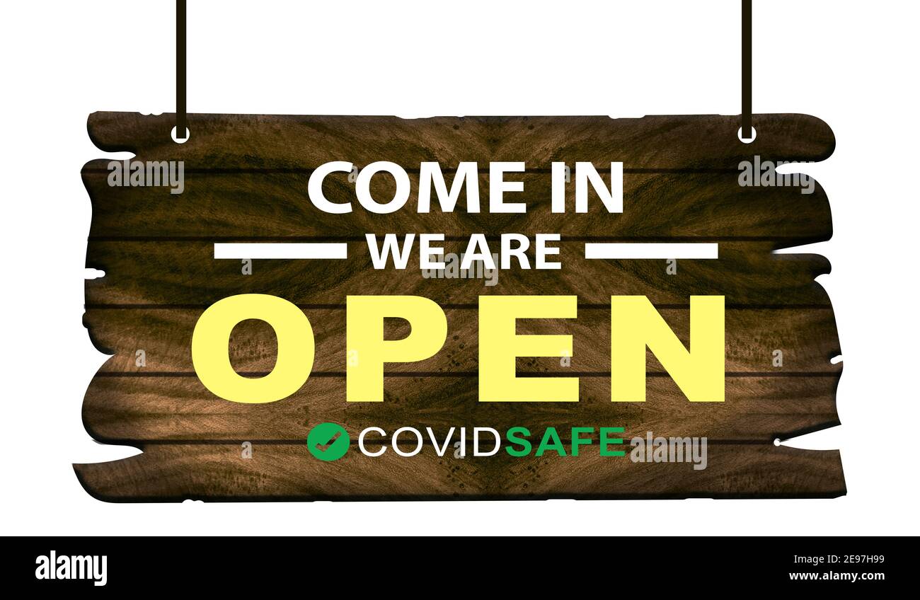 Venez nous sommes ouverts avec une affiche de règles de sécurité covid accrochée sur le devant de la boutique. Banque D'Images
