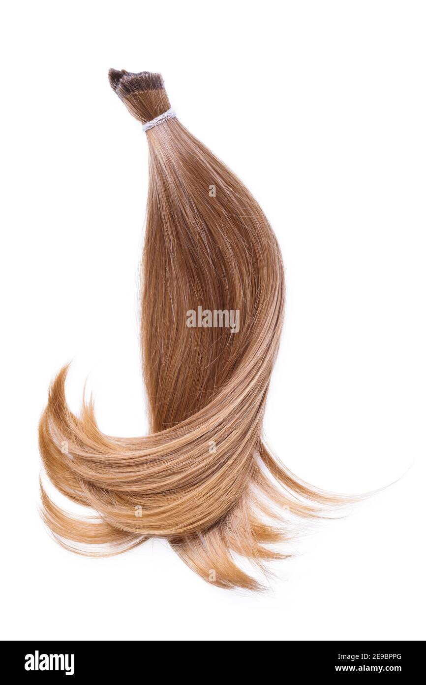 Une mèche de cheveux femelles de couleur claire, isolée sur un fond blanc  Photo Stock - Alamy