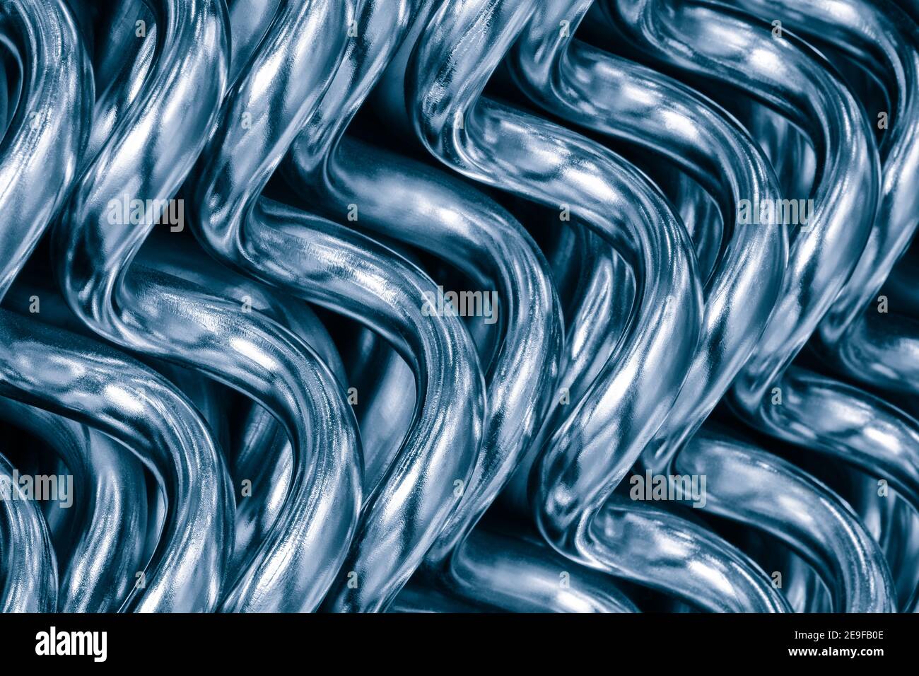 Arrière-plan abstrait des tubes de chauffage incurvés pour l'alimentation en eau industrielle et domestique. Concept de métal industriel Banque D'Images