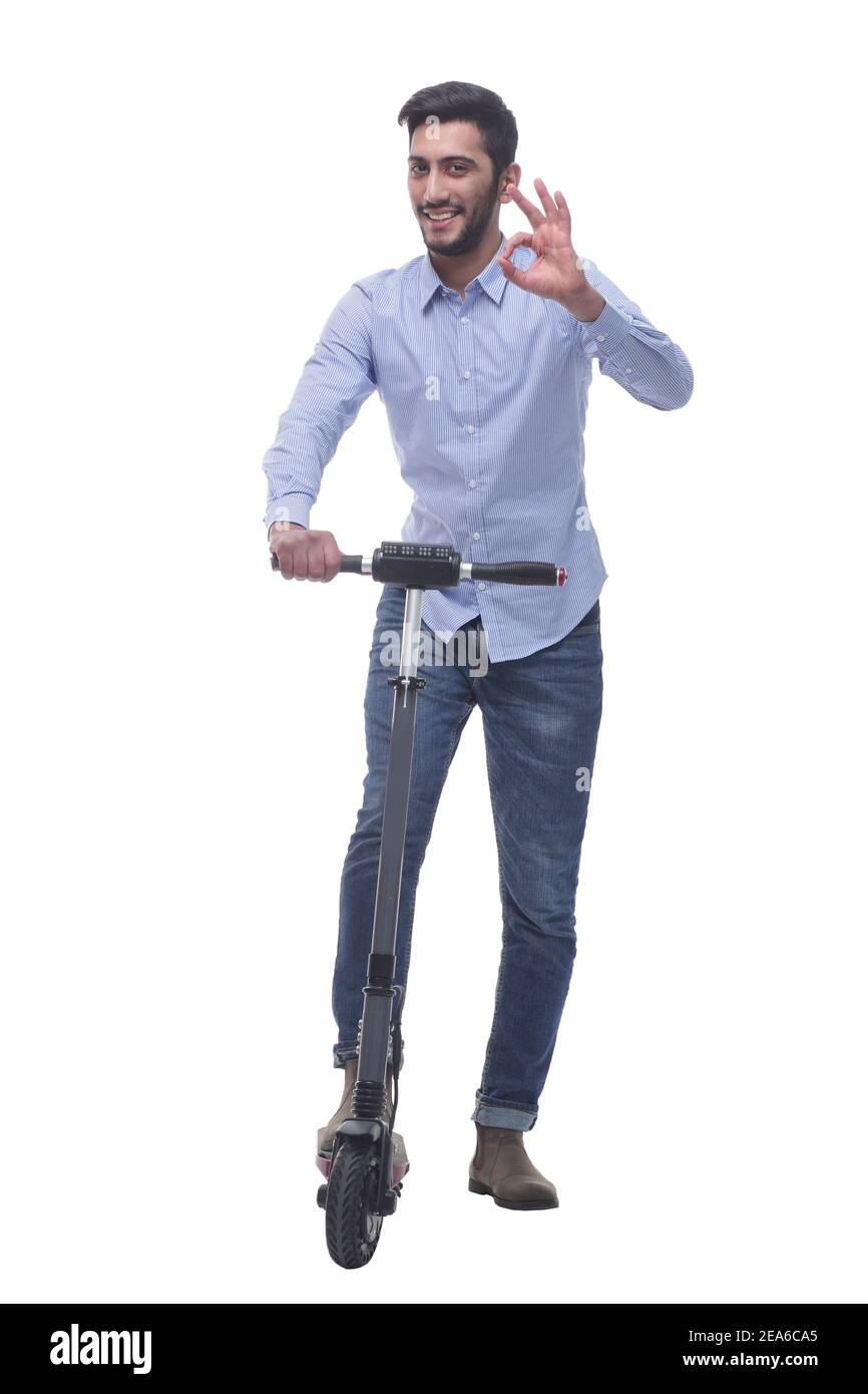 en pleine croissance. jeune homme heureux avec un scooter électrique Banque D'Images