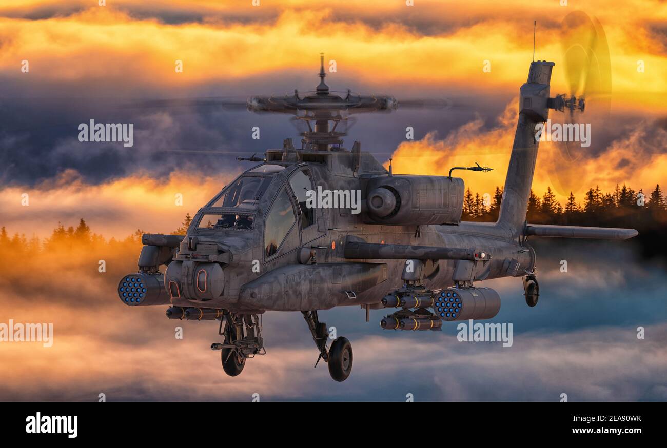 Boeing AH-64 Apache survolant le champ de bataille Banque D'Images
