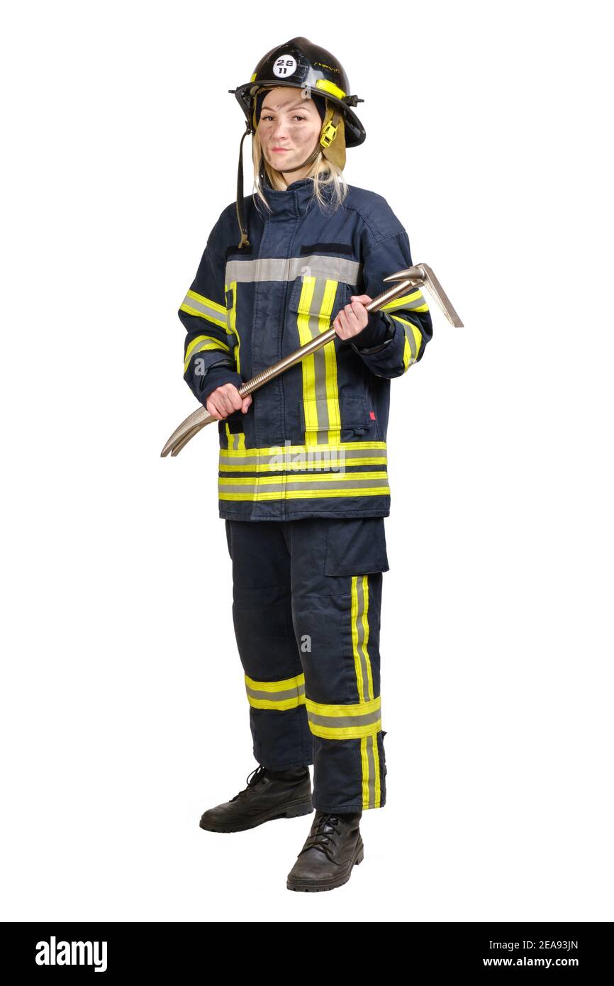 Jeune femme en uniforme de pompier avec crowbar dans les mains Banque D'Images