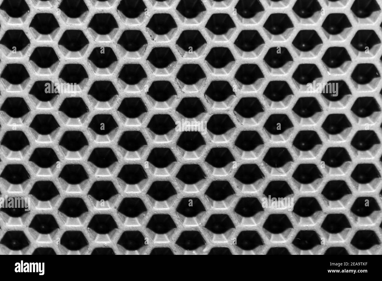 Structure de membrane hexagonale en polymère noir. Texture d'arrière-plan high-tech Banque D'Images