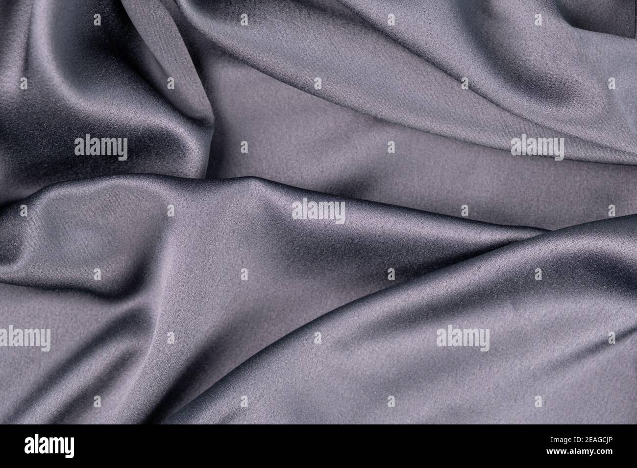fond gris ondulé bleu violet soie satin de soie sur fond Banque D'Images