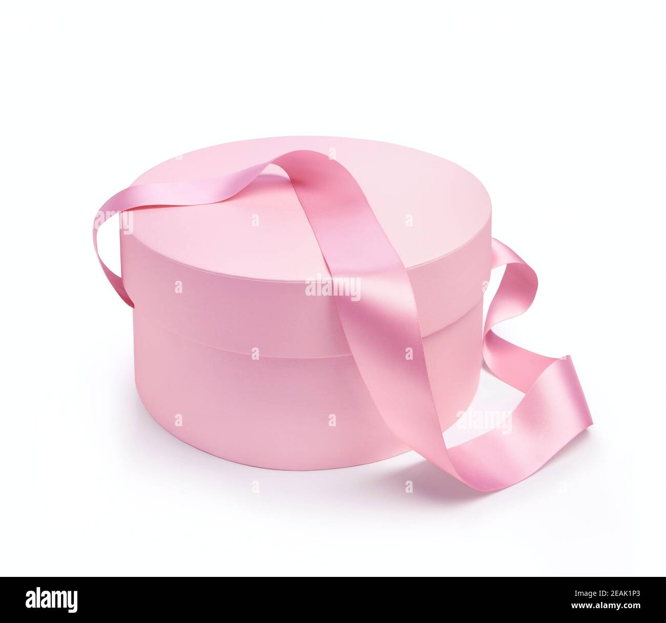 Boîte cadeau de forme ronde de couleur rose sur fond blanc Banque D'Images