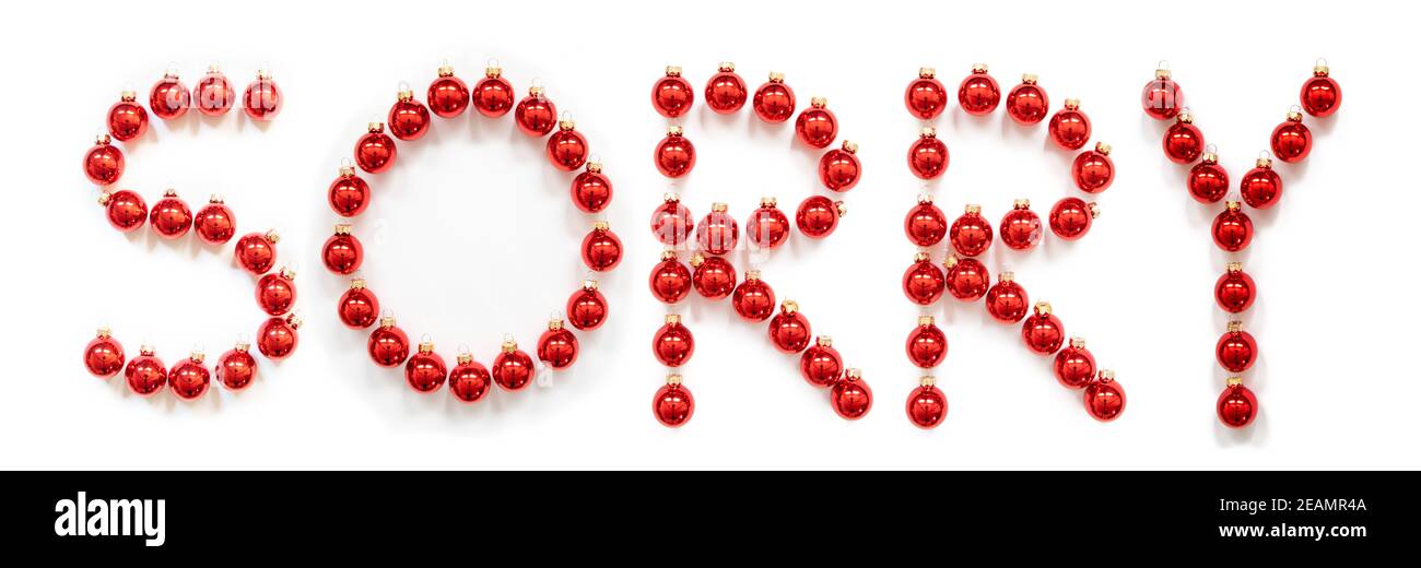 Rouge boule de Noël décoration de bâtiment mot désolé Banque D'Images