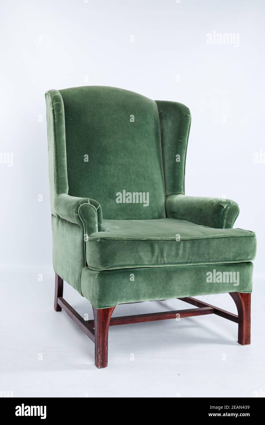 Un meuble de fauteuil vert sage à l'ancienne Banque D'Images