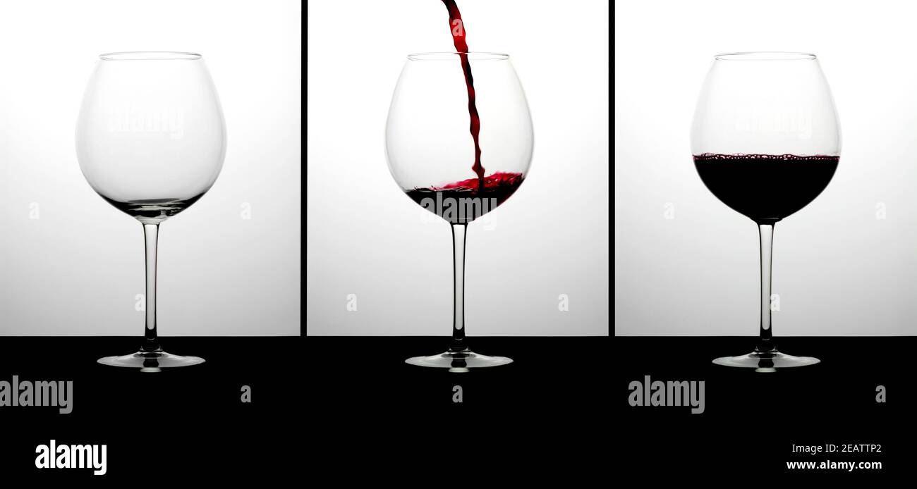 Trois verres de vin rouge et une bouteille Banque D'Images