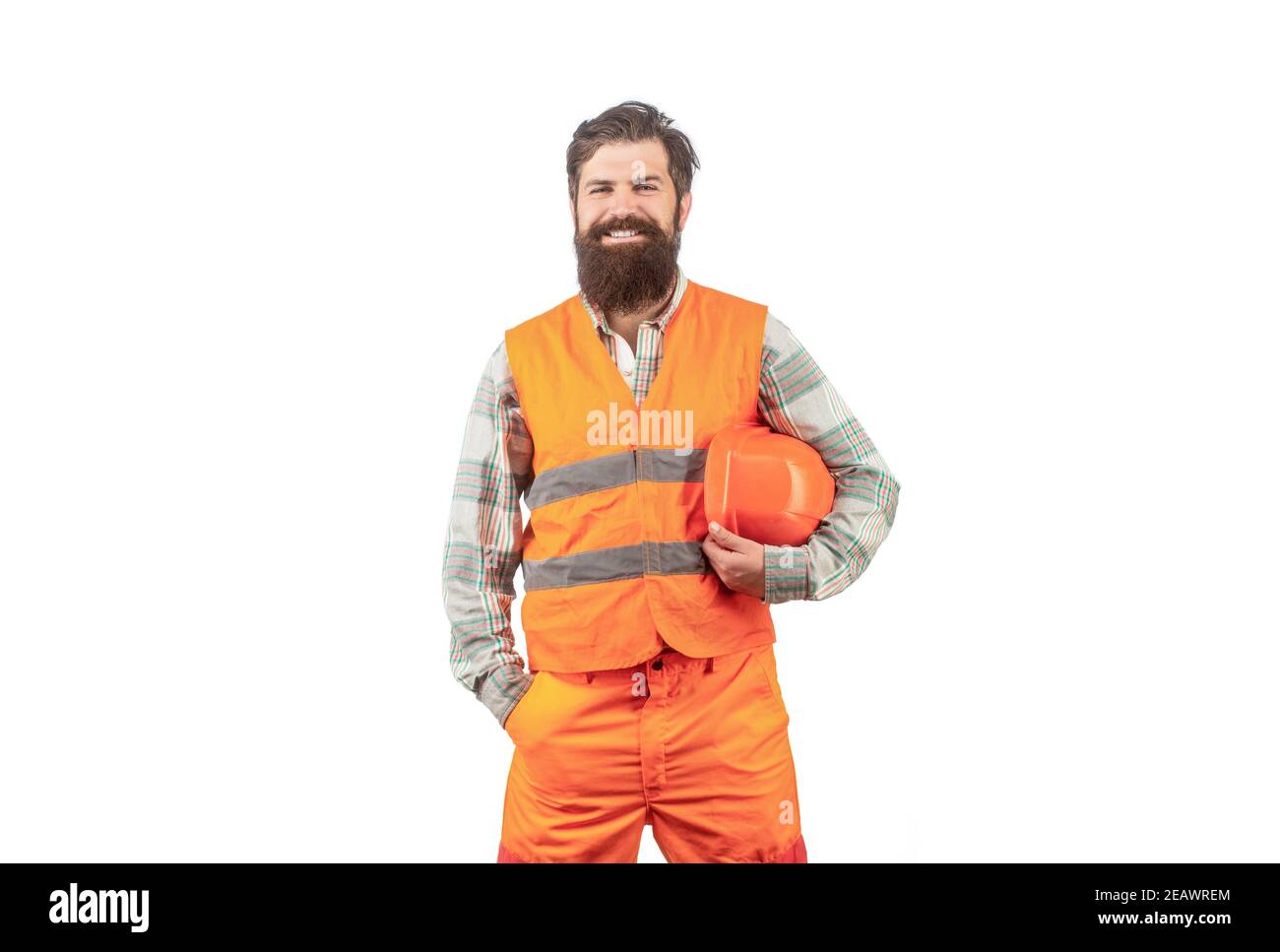 Portrait d'un constructeur souriant. Ouvrier en uniforme de construction. Constructeurs d'hommes, industrie. Constructeur en casque, contremaître ou réparateur dans le casque Banque D'Images