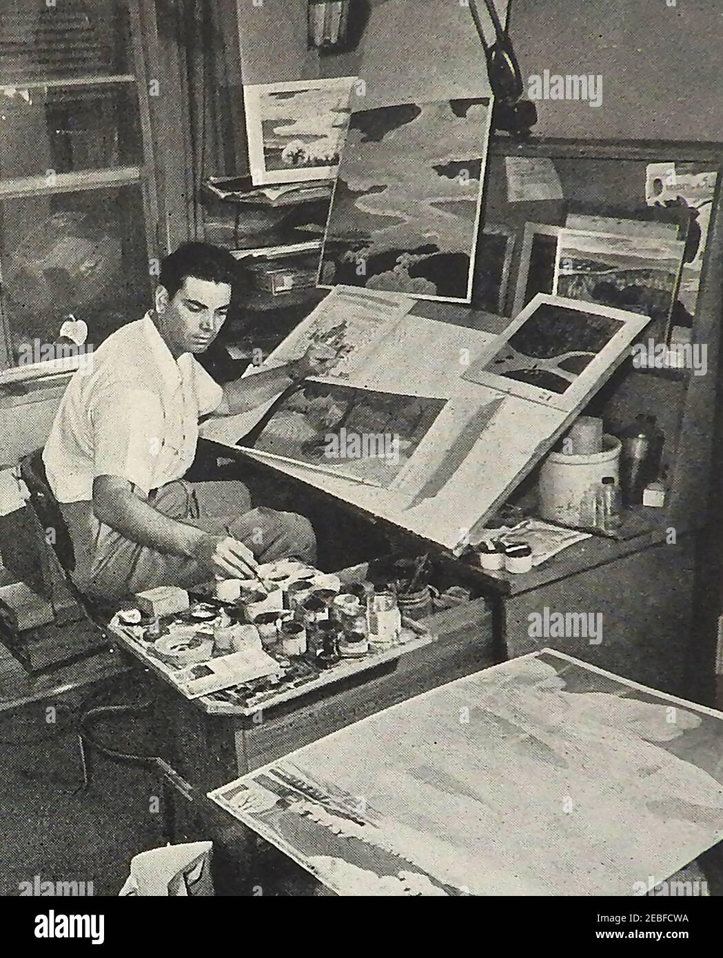 Une photographie de presse de v.1946 montrant un artiste de fond au travail sur le film d'animation de Disney, Melody Time (titre de travail, Sing à propos de quelque chose ) qui était le 10ème long métrage d'animation de Disney et composé de plusieurs séquences de la musique populaire générale et folk . La date de sortie est le 27 mai 1948 - montré par RKO ( Keith-Albee-Orpheum) radio Pictures. Banque D'Images