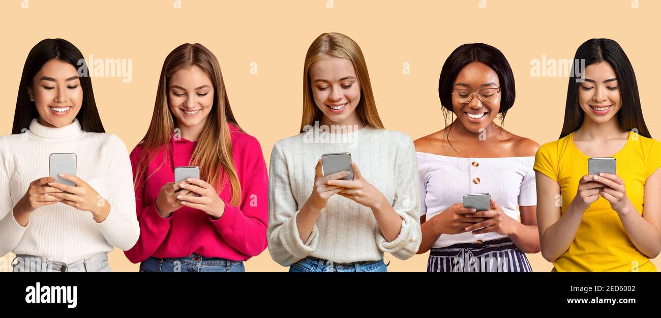 Les femmes multiraciales positives sont coincées dans les smartphones pour magasiner, étudier, travailler ou communiquer sur les réseaux sociaux Banque D'Images