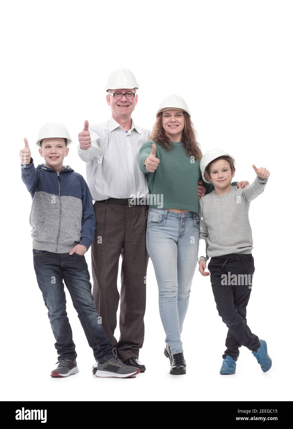 en pleine croissance. famille heureuse en casques de protection. Banque D'Images