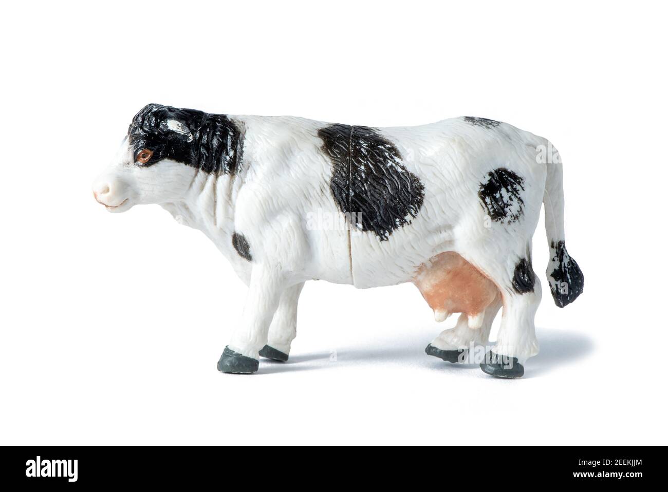 Animal de ferme. Magnifique jouet en caoutchouc blanc et noir vache isolée sur fond blanc Banque D'Images
