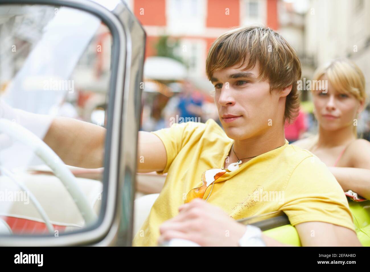 Close-up of a young man sitting in a car Banque D'Images