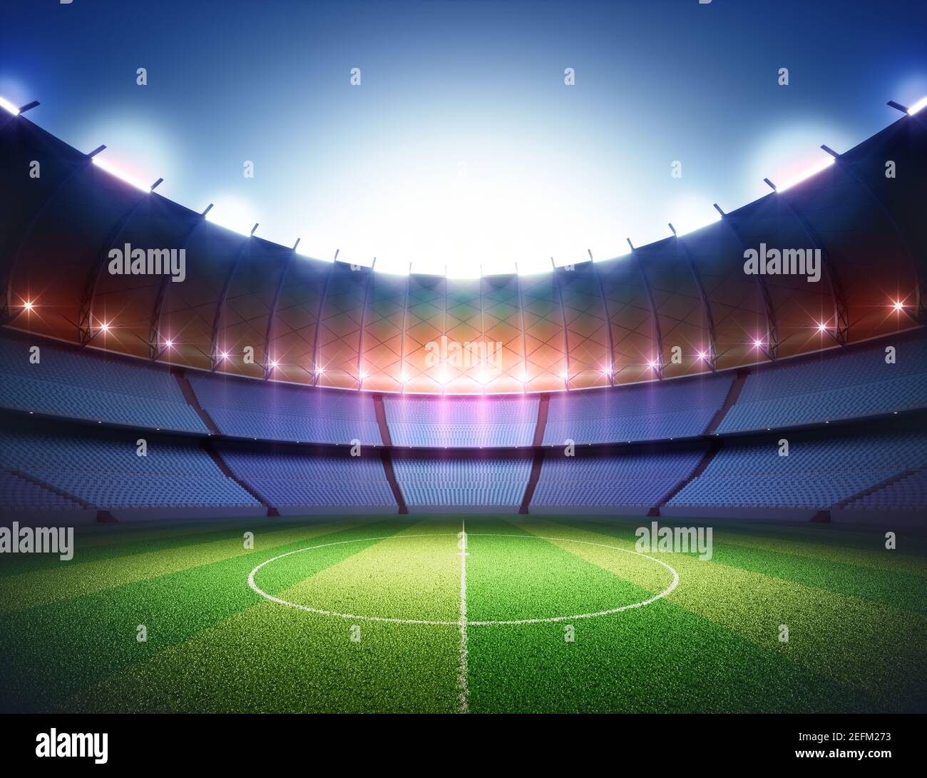 Terrain de football dans le stade. Pelouse éclairée au centre par les lumières environnantes. Banque D'Images