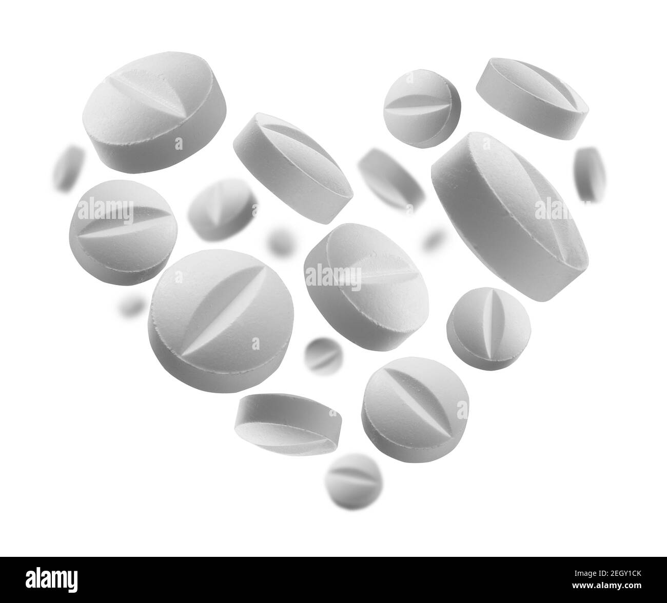 Des comprimés ronds blancs en forme de cœur un arrière-plan blanc Banque D'Images