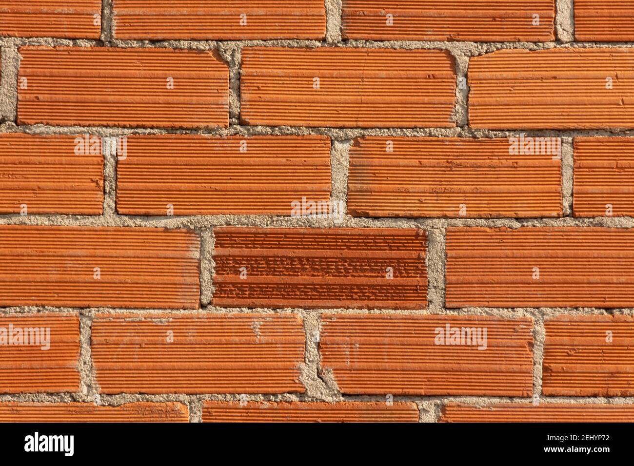 Fond de mur de briques rouges avec ciment, France Banque D'Images