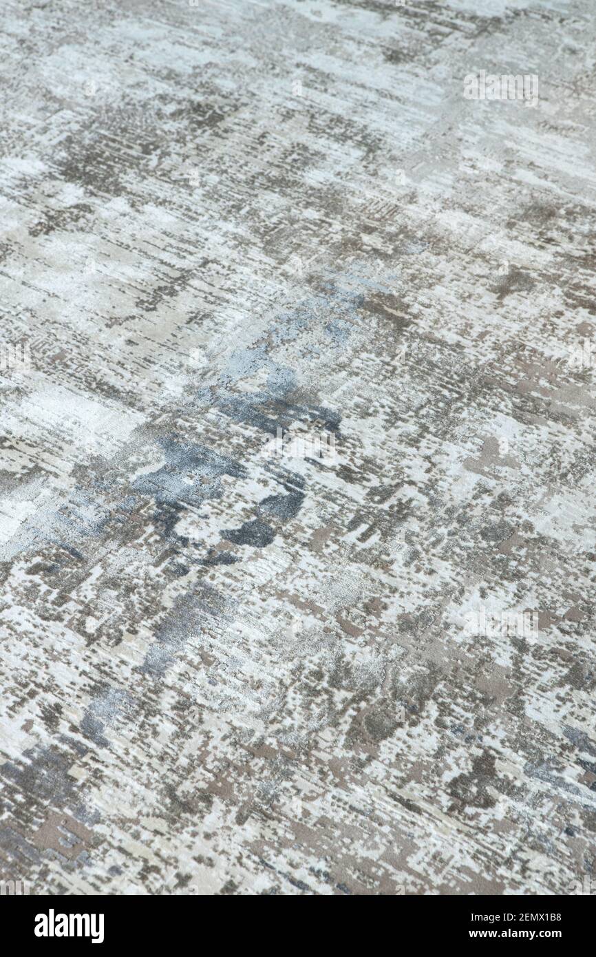 Arrière-plan d'une élégante moquette dans des tons gris-beige-bleu neutres avec un effet de décoloration et d'antiquité artificielle. Détails du concept d'un interi à la mode Banque D'Images