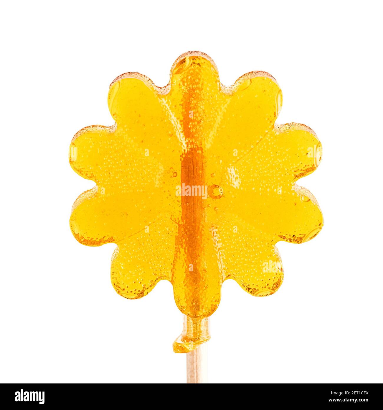 Sucettes en forme de fleur. Lollipop jaune sur fond blanc Banque D'Images