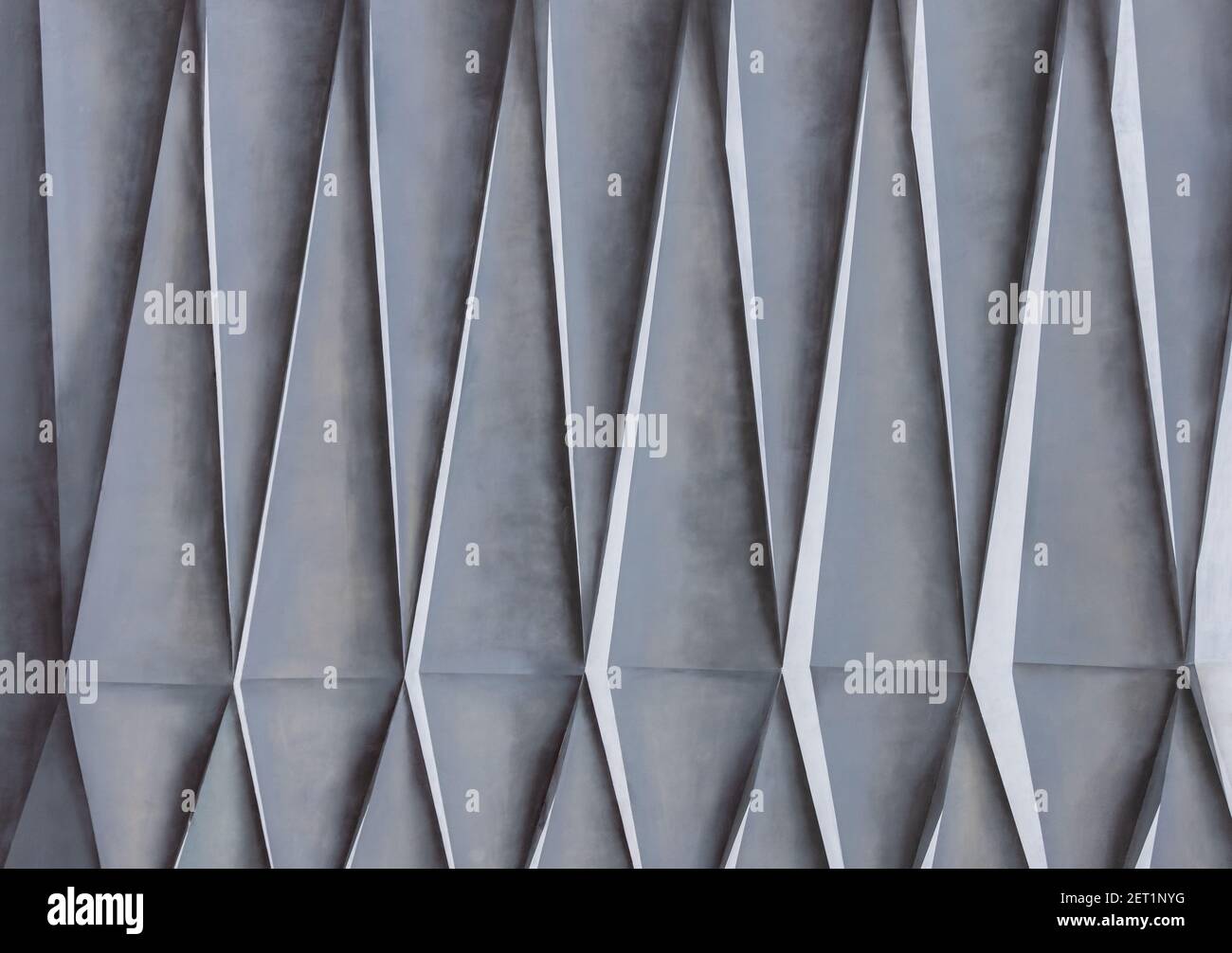 Texture géométrique sur la façade de la maison. Formes triangulaires. Banque D'Images