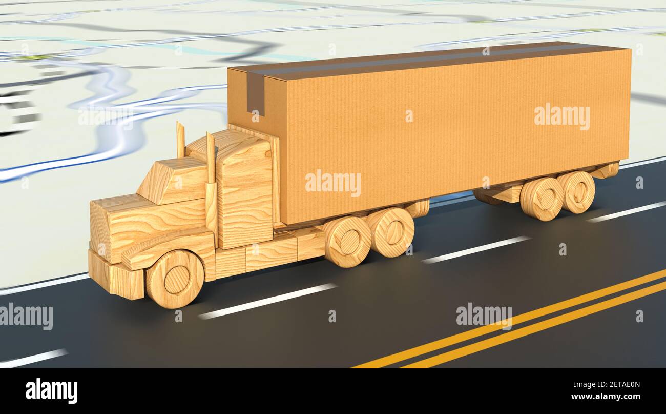 Un camion de jouets en bois transportant une grande boîte en carton se déplace rapidement sur la route. Banque D'Images