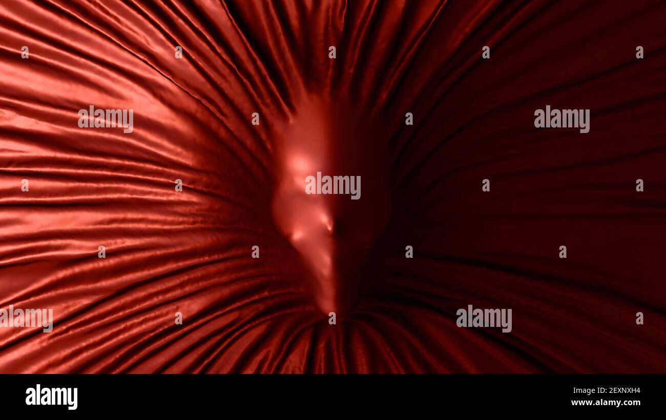 Crâne révélant sous UN tissu de soie rouge Banque D'Images