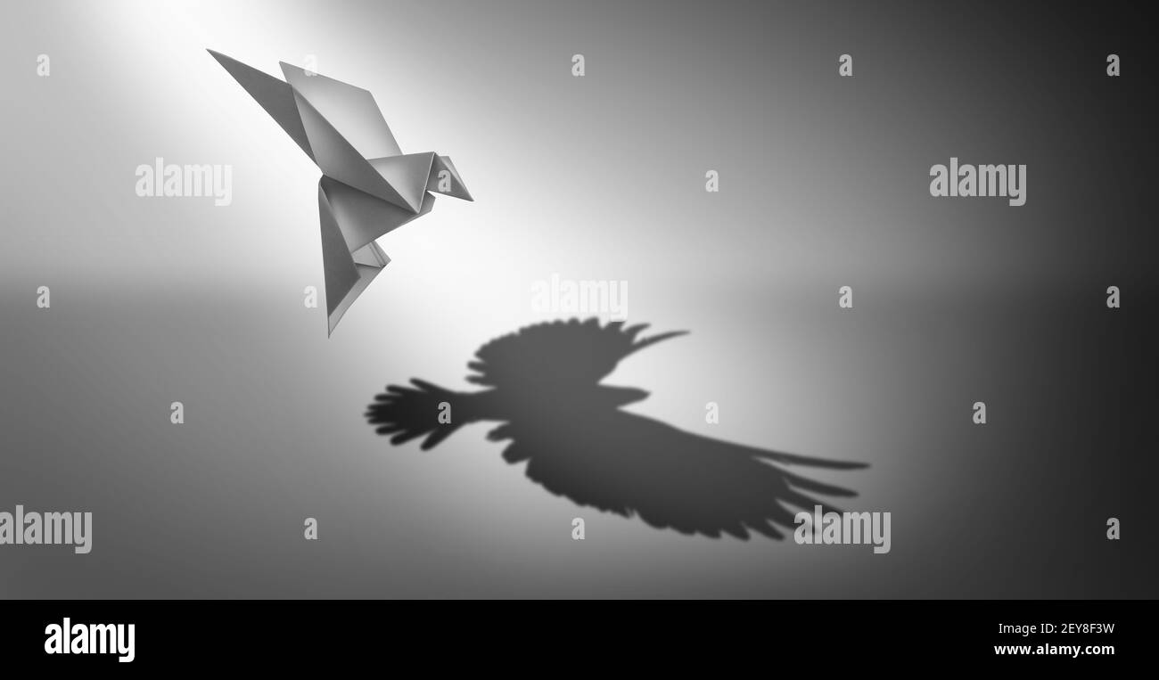 Vision et ambition en tant que symbole commercial du pouvoir de leadership et métaphore du succès de la croissance en tant qu'oiseau de papier origami jetant une ombre de puissant. Banque D'Images