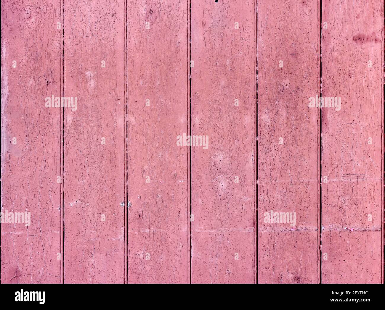 Bandes verticales de bois avec peinture rose craquelée Banque D'Images