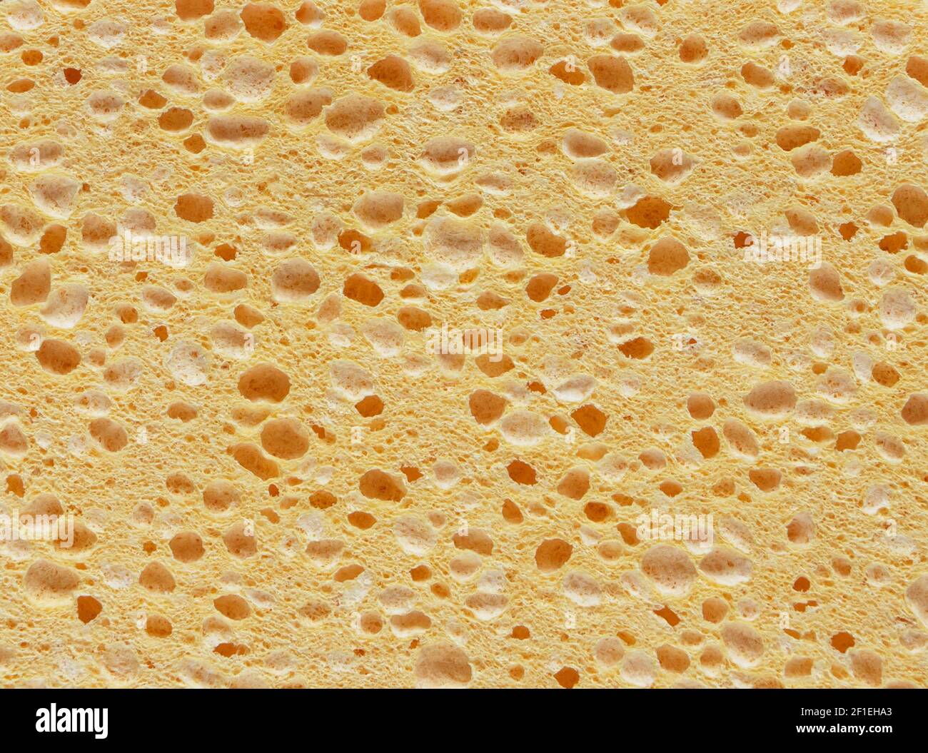 Nuance de texture éponge de lavage synthétique jaune Banque D'Images