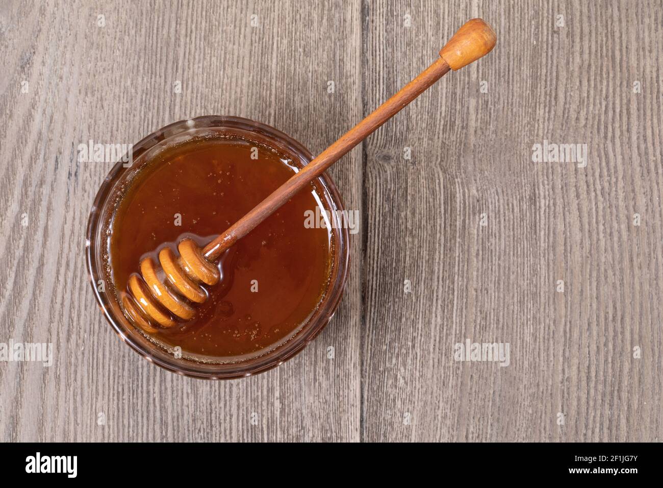 Miel dans un pot transparent Banque D'Images